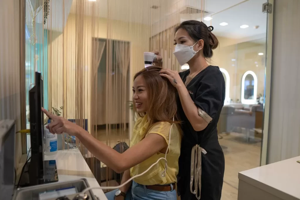 Hair Care Specialist Providing Hair Nourishing Services