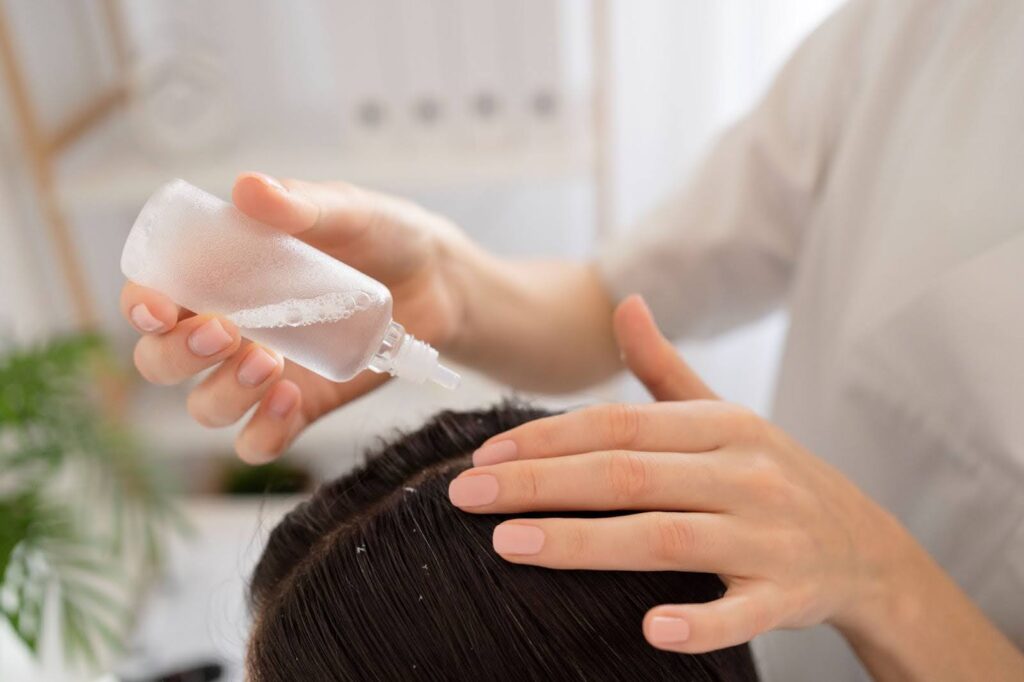 Woman Receiving Herbal Solution Scalp Treatment